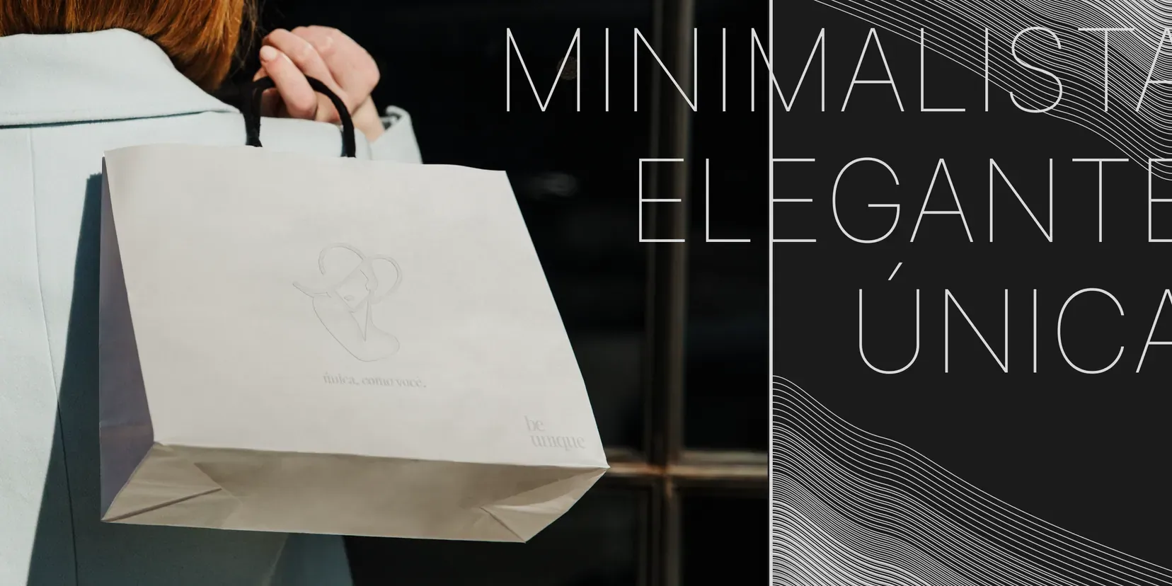 A shopping bag carrying the mark, held against a shopfront.