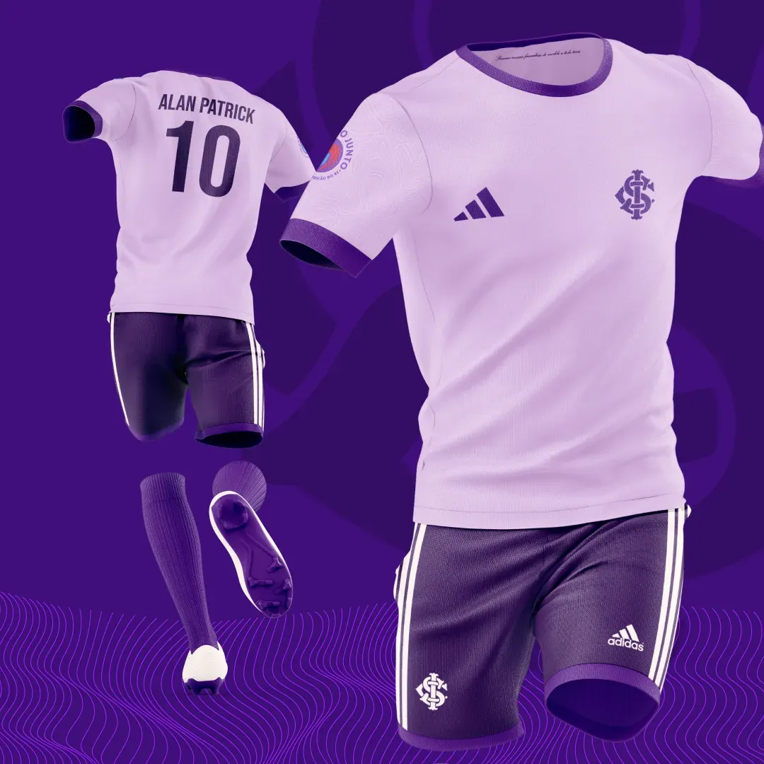 A lilac-white variant of the kit with purple shorts.